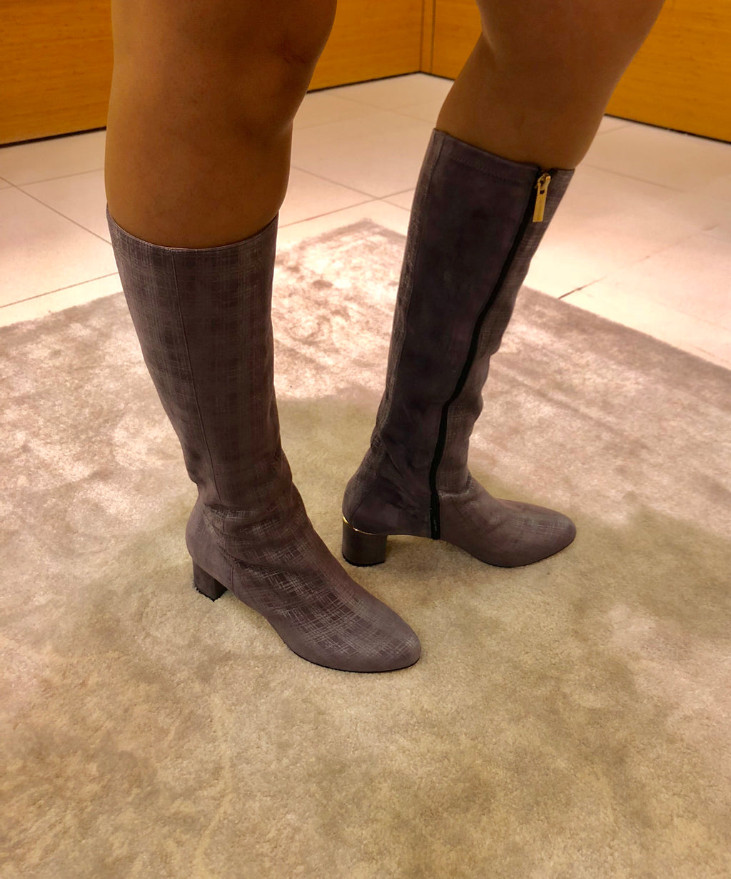 Knee-high light purple boots with a low heel